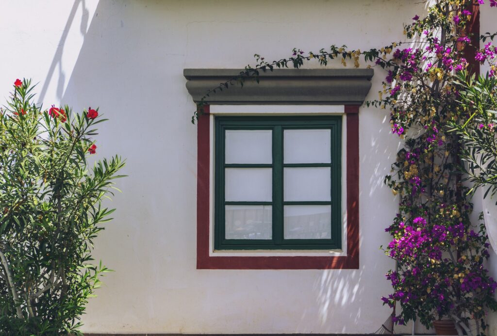 Historic home with forest green window frame