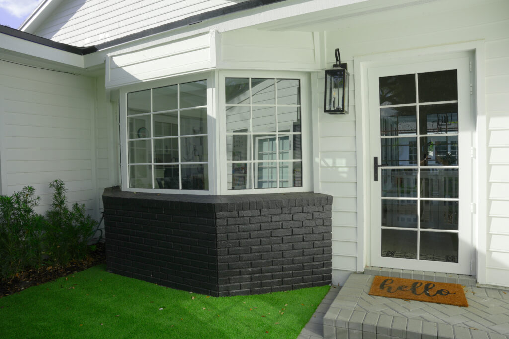 View of a white front door and window